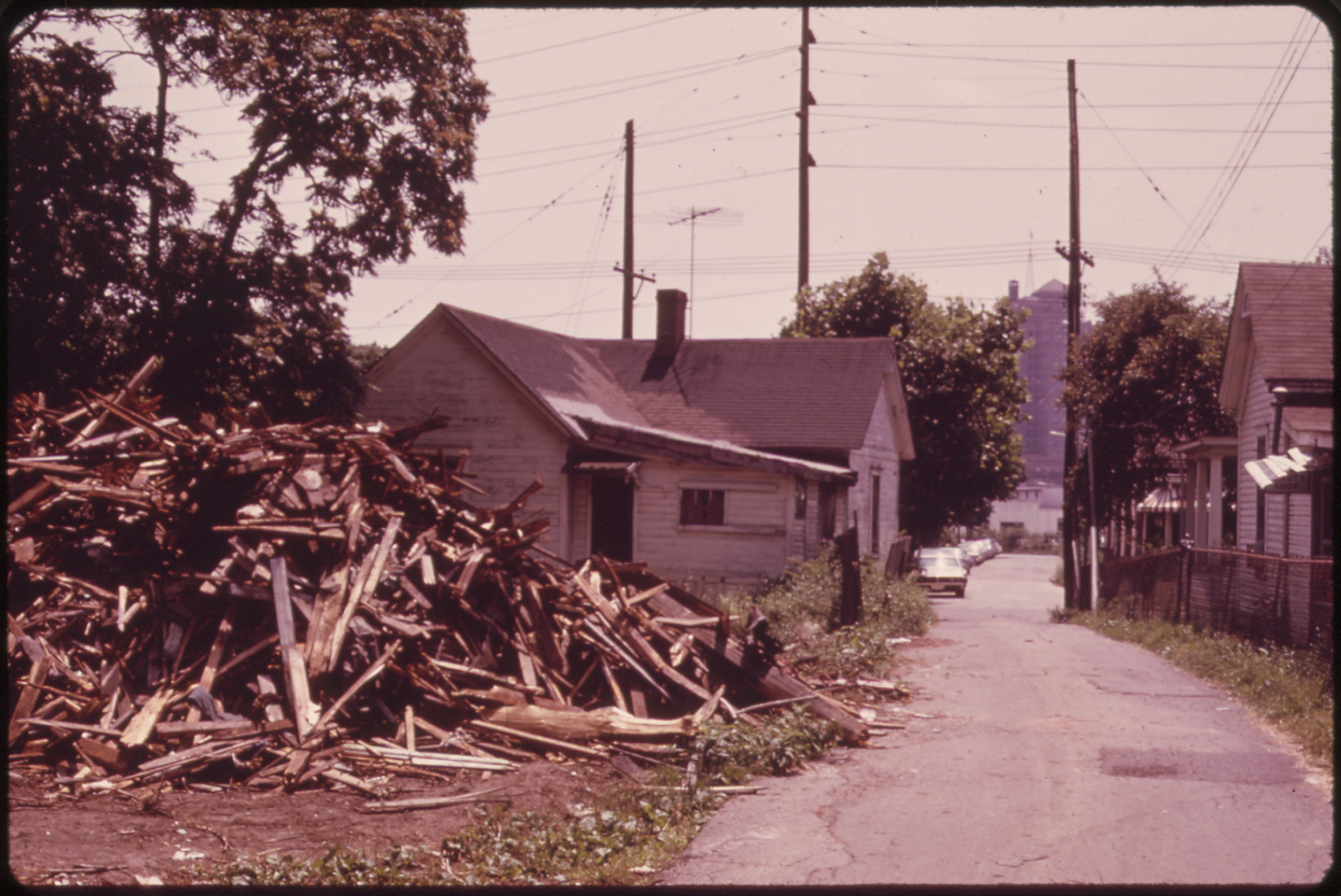 Razed houses and others due for demolition as part of an urban renewal project in Charleston, West Virginia, 1973